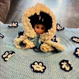 Blue and white bed doll